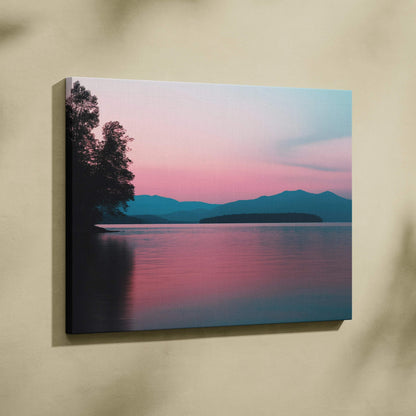Canvas wall art with serene pink and blue sunset over calm lake and silhouetted trees and mountains.