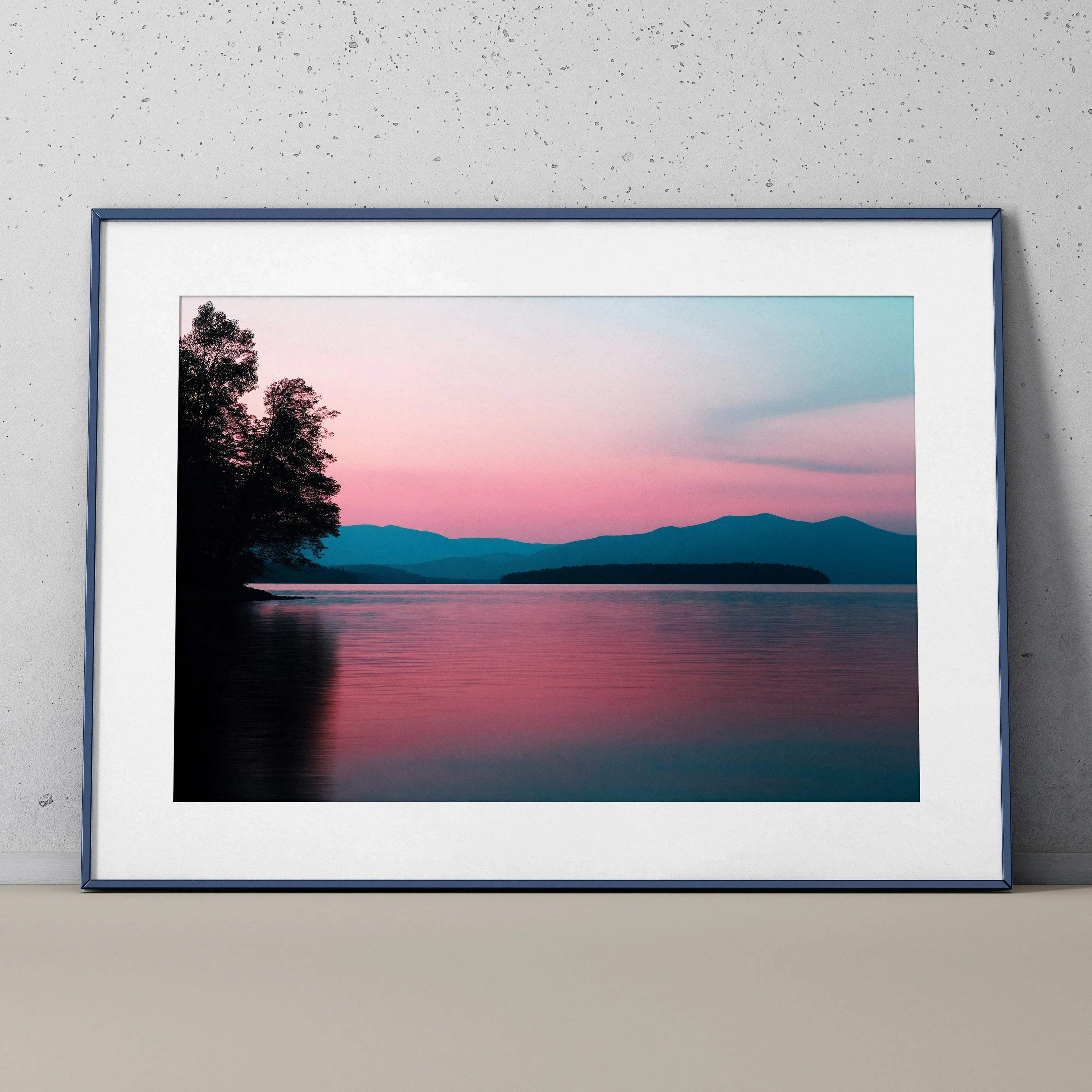 Framed digital art poster of a forest lake at sunset with pink and blue hues, wall art.