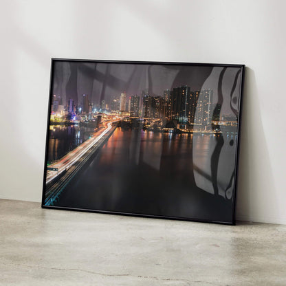 Vibrant city night skyline wall art poster with illuminated buildings and bridge reflections.