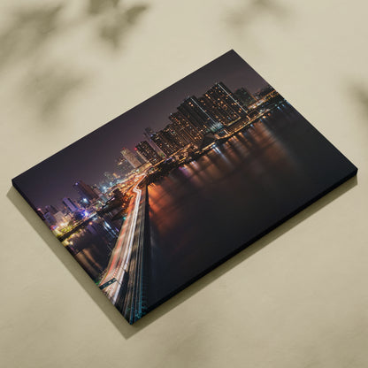 Cityscape canvas wall art with vibrant night lights and reflections, museum-quality print.