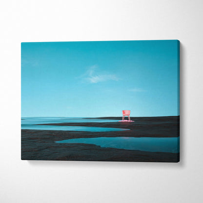 Minimal surreal coastal scene: pink chair on wet sand under turquoise sky canvas print