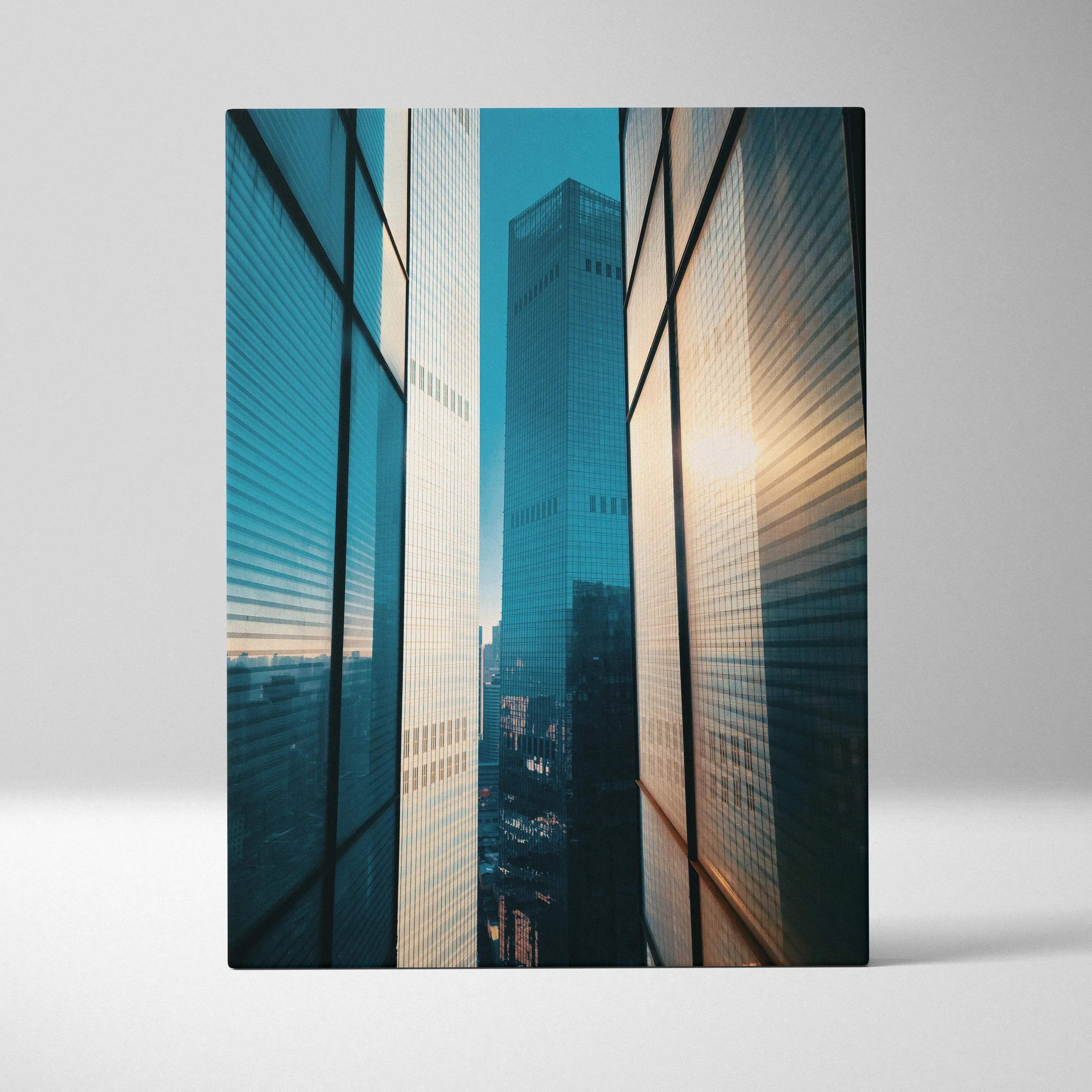 Vertical canvas wall art featuring high-resolution urban skyscraper buildings at sunset with reflective glass panels.