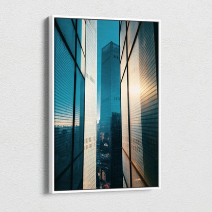 Vertical canvas wall art depicting high-resolution urban buildings with sunlit reflections.