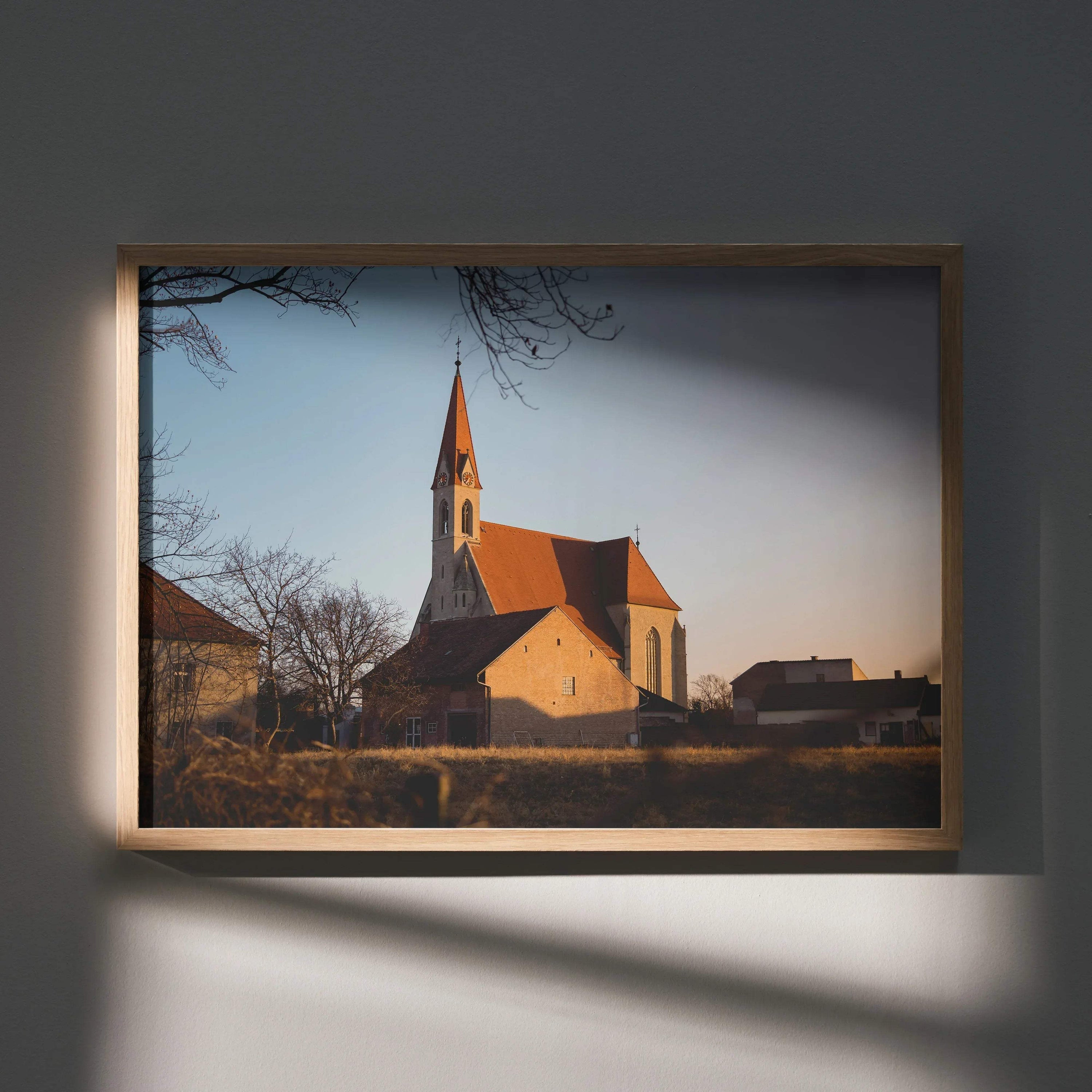 Serene church landscape with warm light, wood frame wall art poster print.
