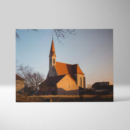 Canvas wall art featuring a church with a tall steeple against a clear sky at sunset.