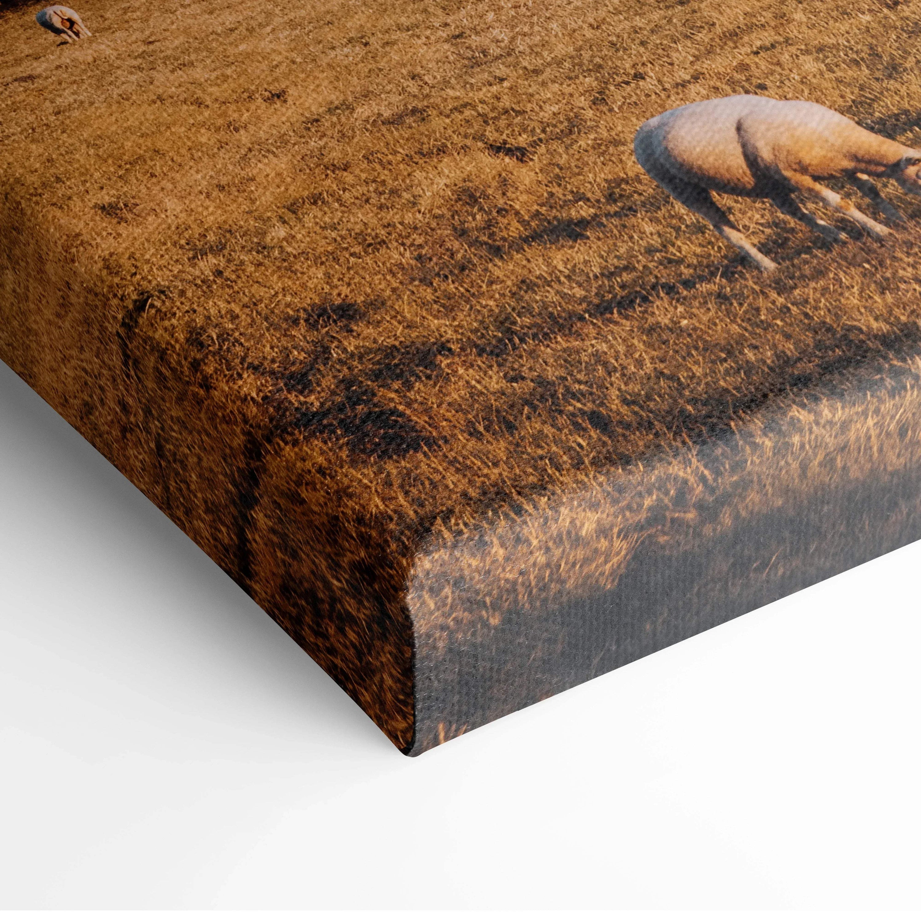 Close-up of textured canvas wall art featuring a warm-toned urban architecture print with abstract building details.
