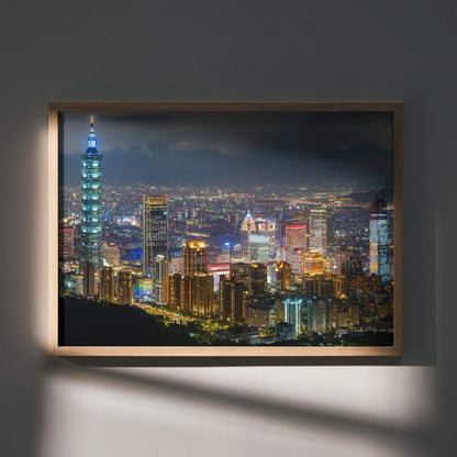 City night skyline wall art poster featuring illuminated skyscrapers and city lights in a wooden frame.