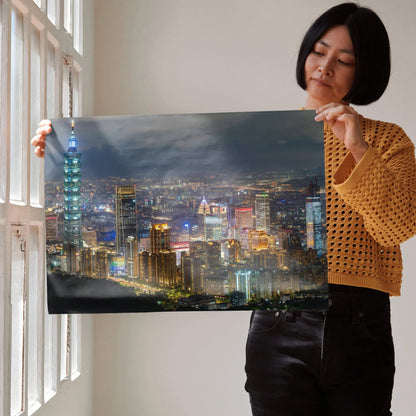 City night skyline wall art poster with illuminated skyscrapers and dark cloudy sky.
