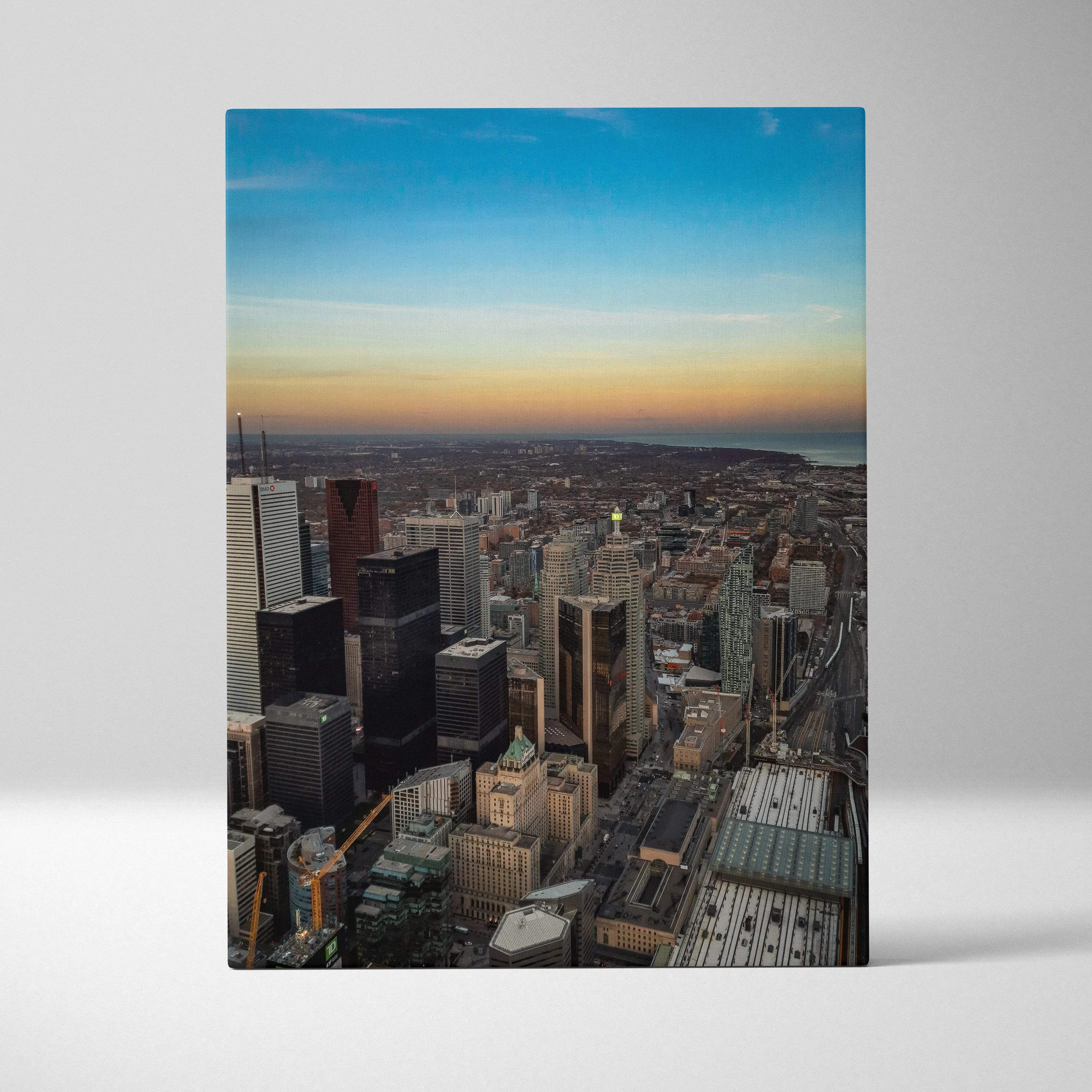 Golden hour city skyline canvas wall art features a vibrant rectangular print of skyscrapers at sunset with gradient sky