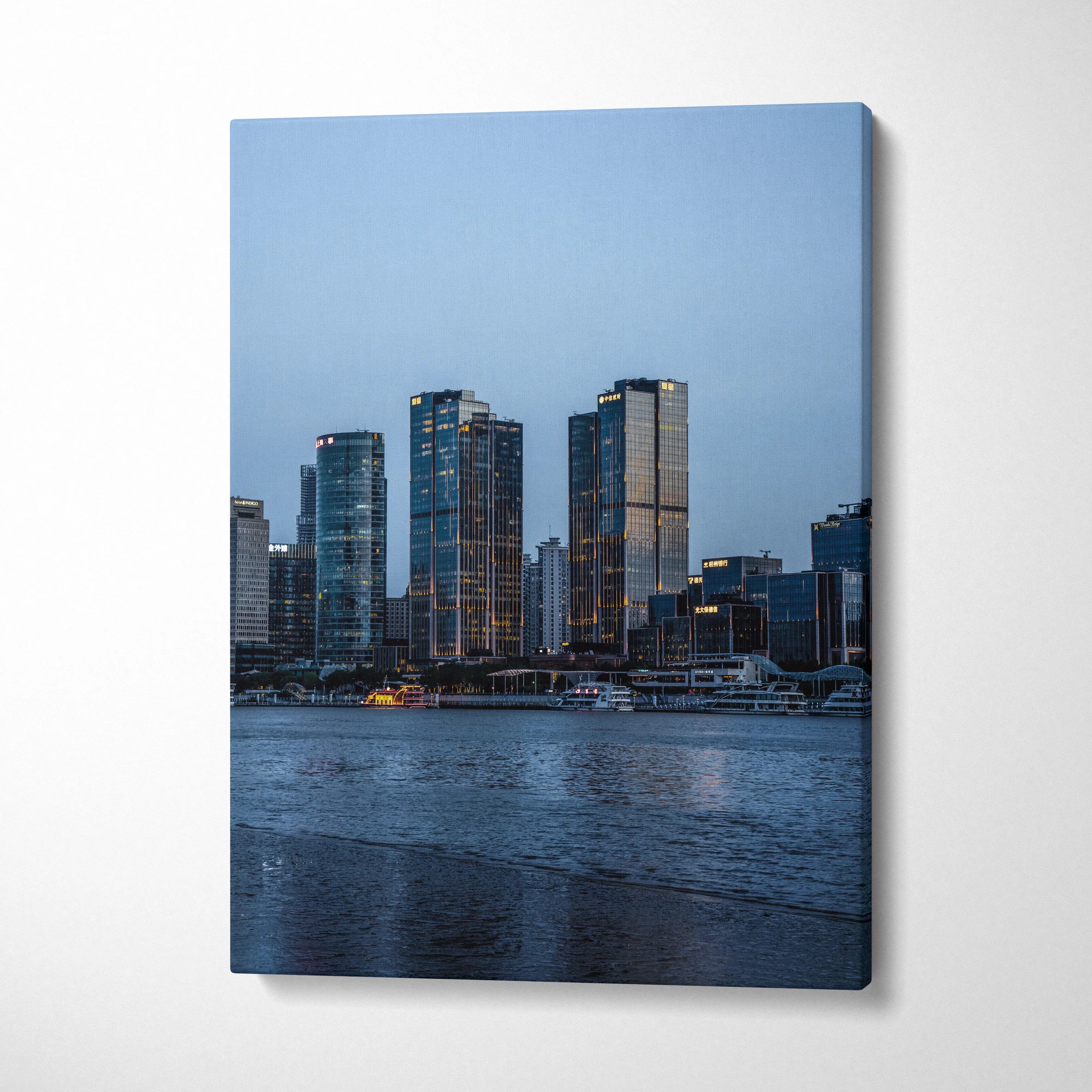 Canvas wall art featuring a serene urban cityscape with illuminated skyscrapers at dusk.