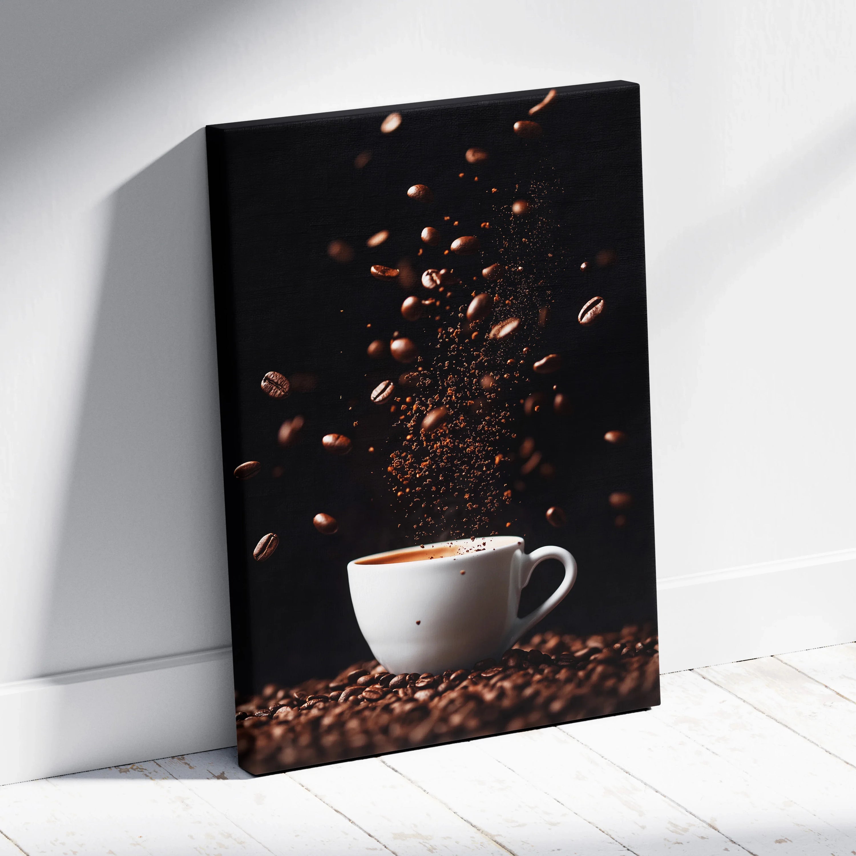 Canvas wall art featuring a white coffee cup with coffee beans and grounds floating against a black background.
