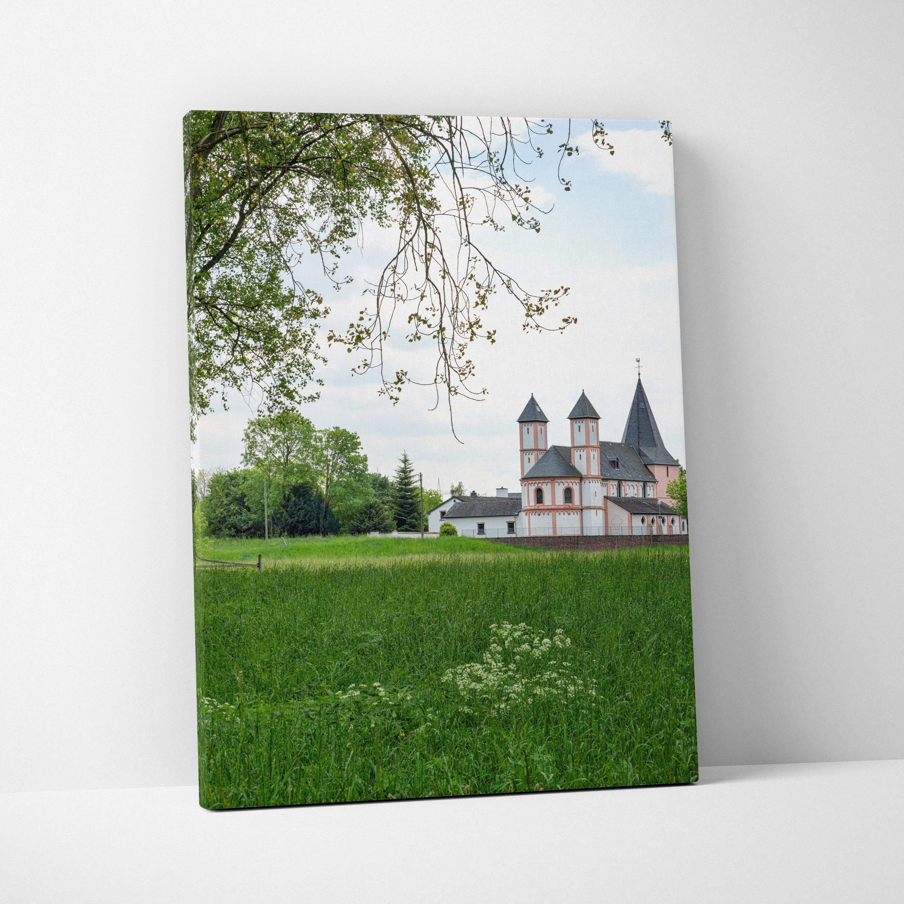 Canvas wall art featuring a serene urban building with white walls and dark roofs against a blue sky.
