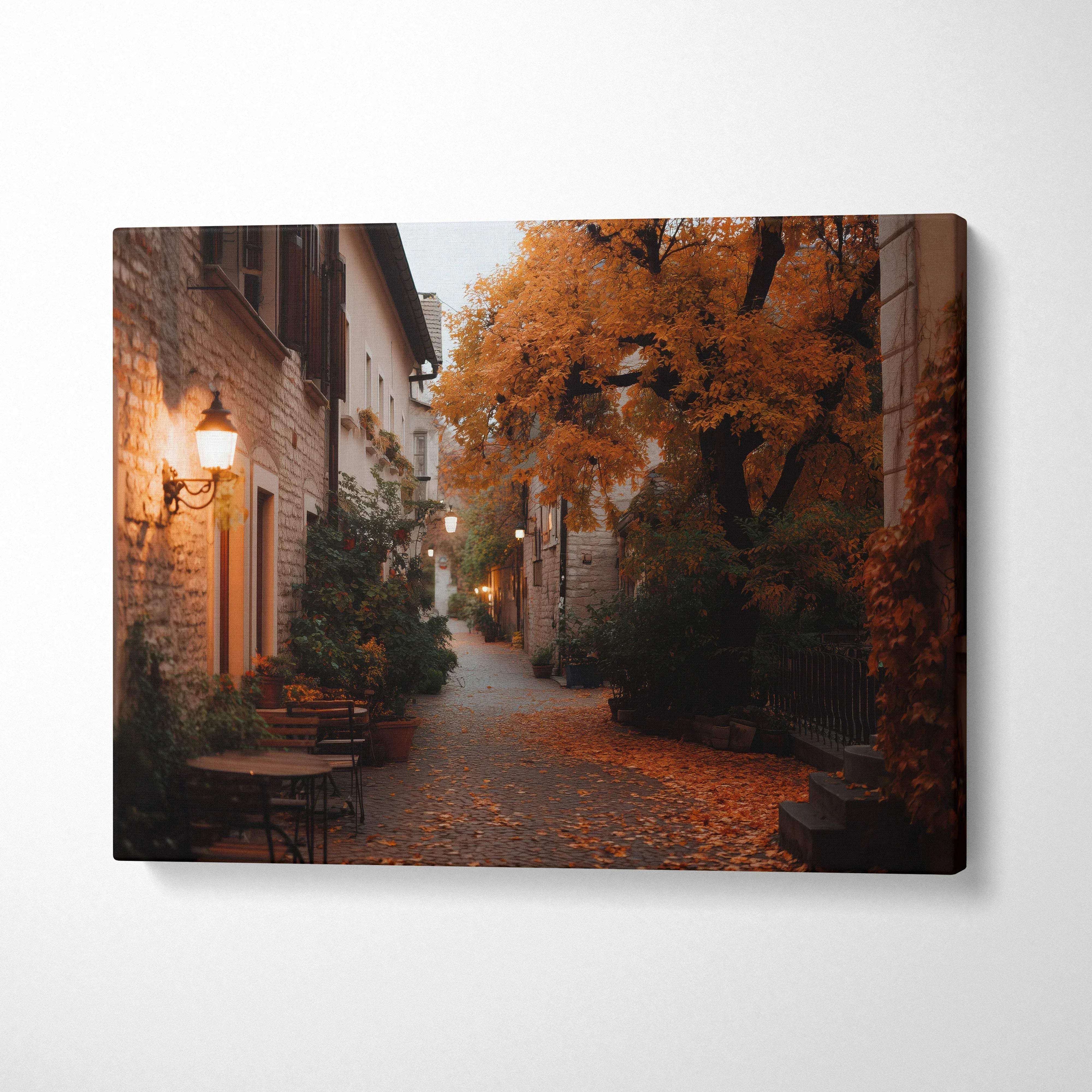 Vibrant autumn scene canvas wall art with orange foliage and cobblestone street lighting.
