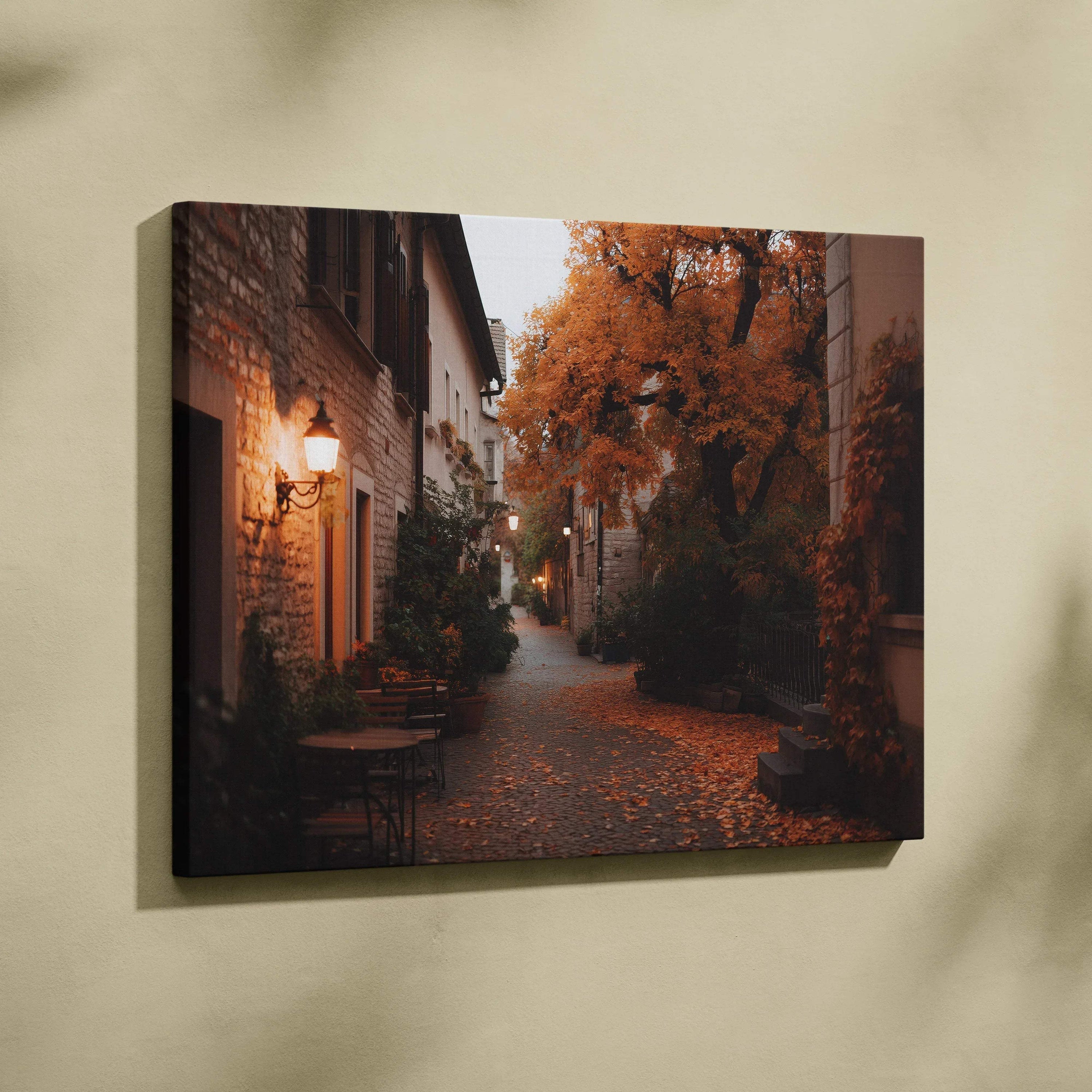 Canvas wall art featuring a cozy autumn street scene with orange foliage and warm lighting.