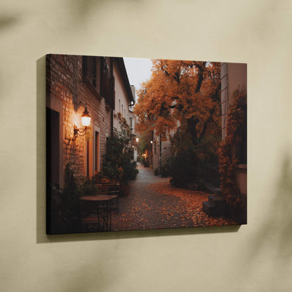Canvas wall art featuring a cozy autumn street scene with orange foliage and warm lighting.