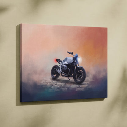 A sleek silver and black bmw r ninet inspired cafe racer motorcycle canvas print with glowing headlights on sunset backdrop