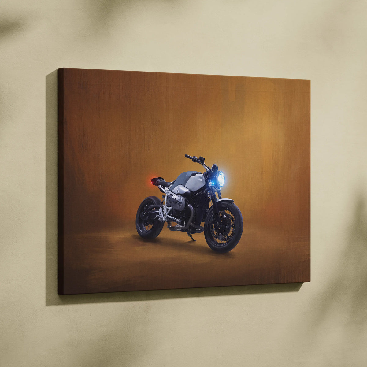 Canvas print of bmw r ninest inspired modern motorcycle with glowing headlights and red taillight on warm brown backdrop