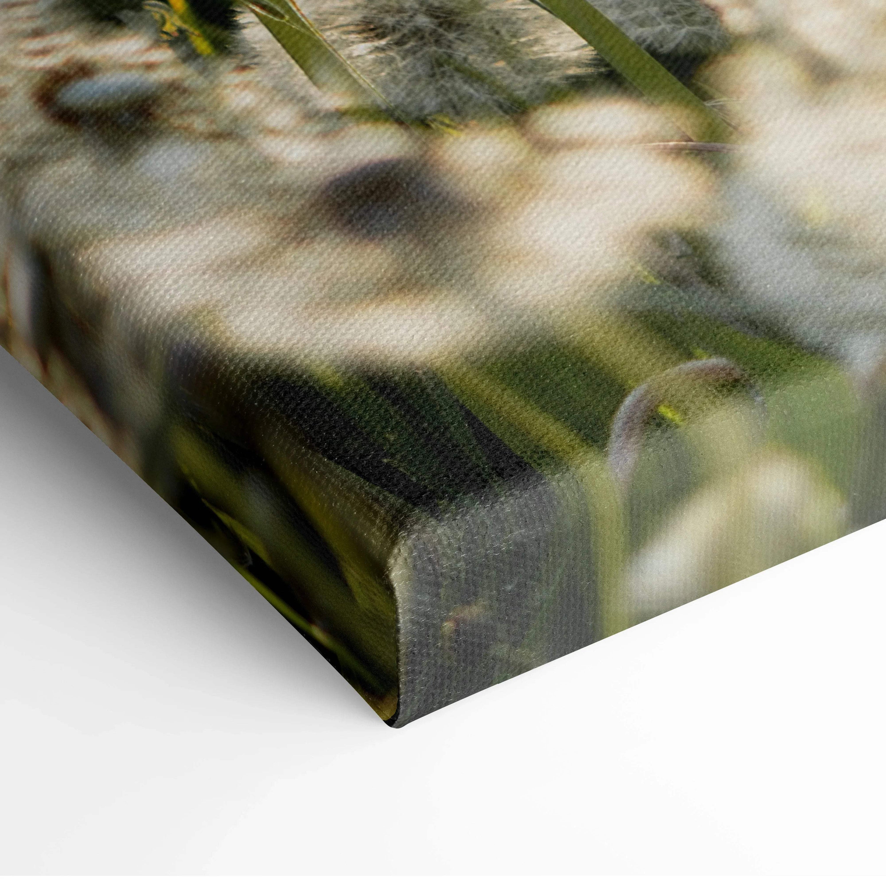 Close-up of floral canvas wall art with soft-focus white flowers and green foliage on textured surface.