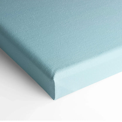 Light blue textured canvas stretched over a wooden frame for wall art display.