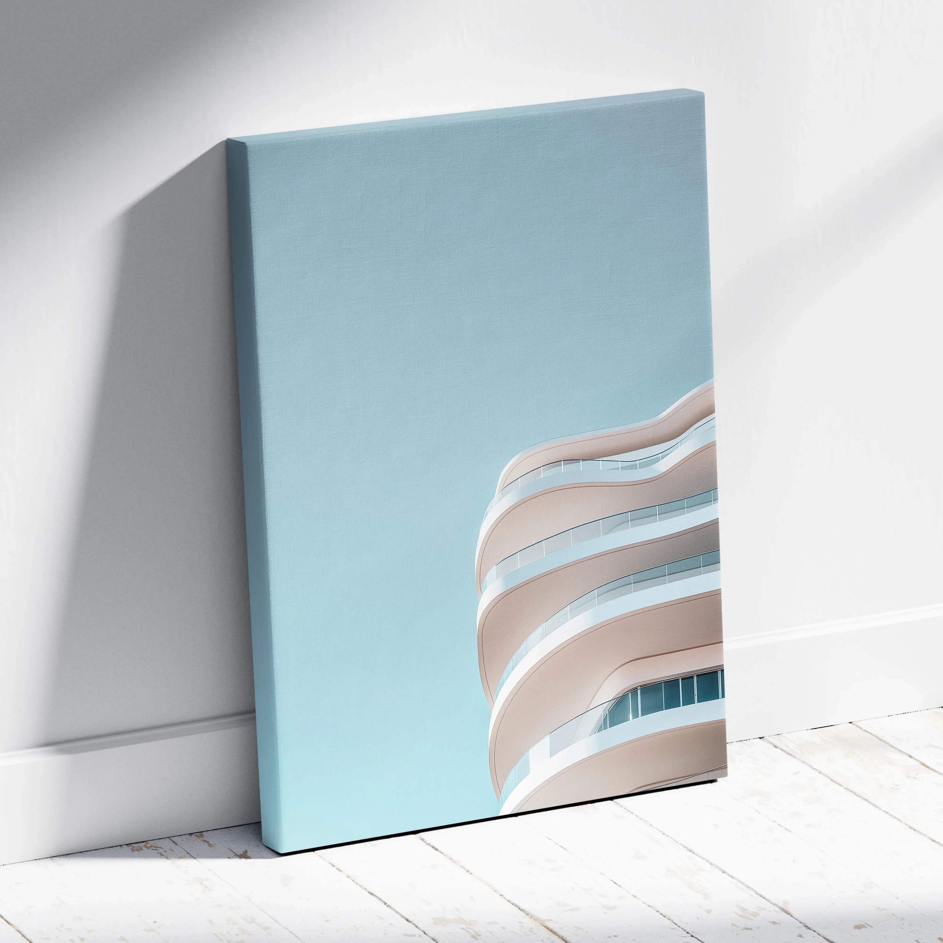 Canvas wall art featuring smooth, curved urban building facade against clear blue sky.