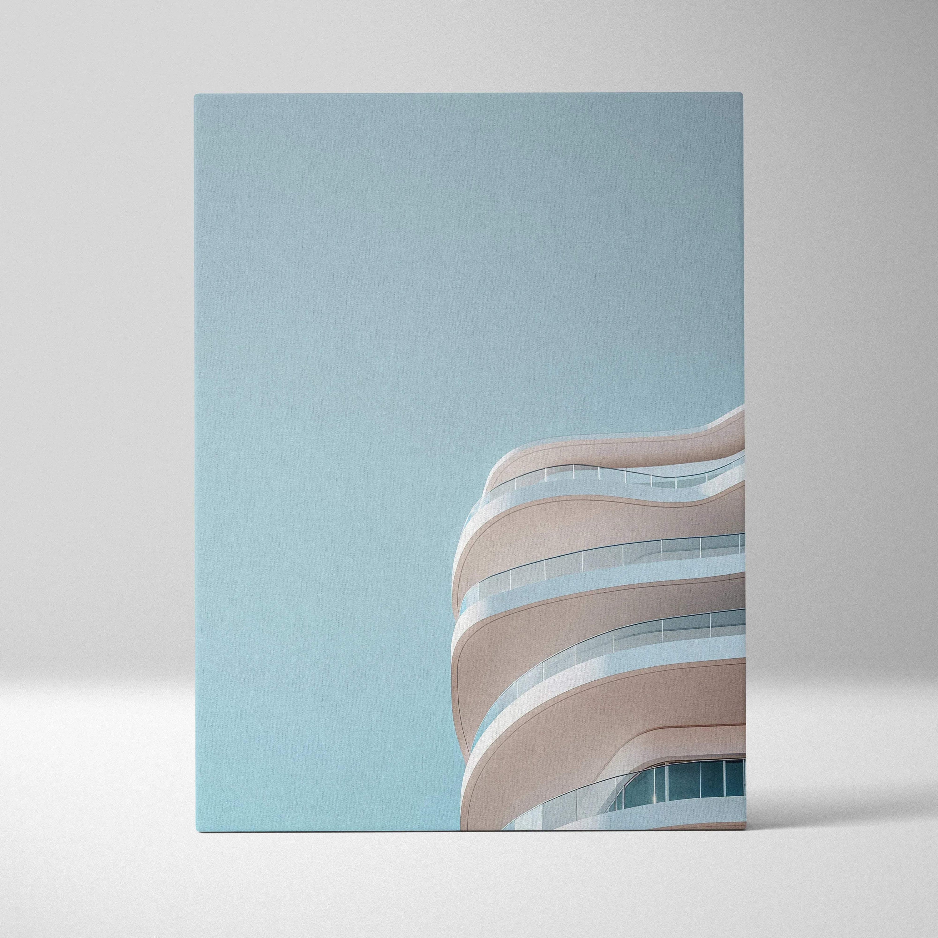 Canvas wall art featuring sleek white curved urban building balconies against a clear blue sky.