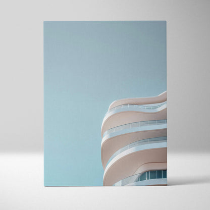 Canvas wall art featuring sleek white curved urban building balconies against a clear blue sky.