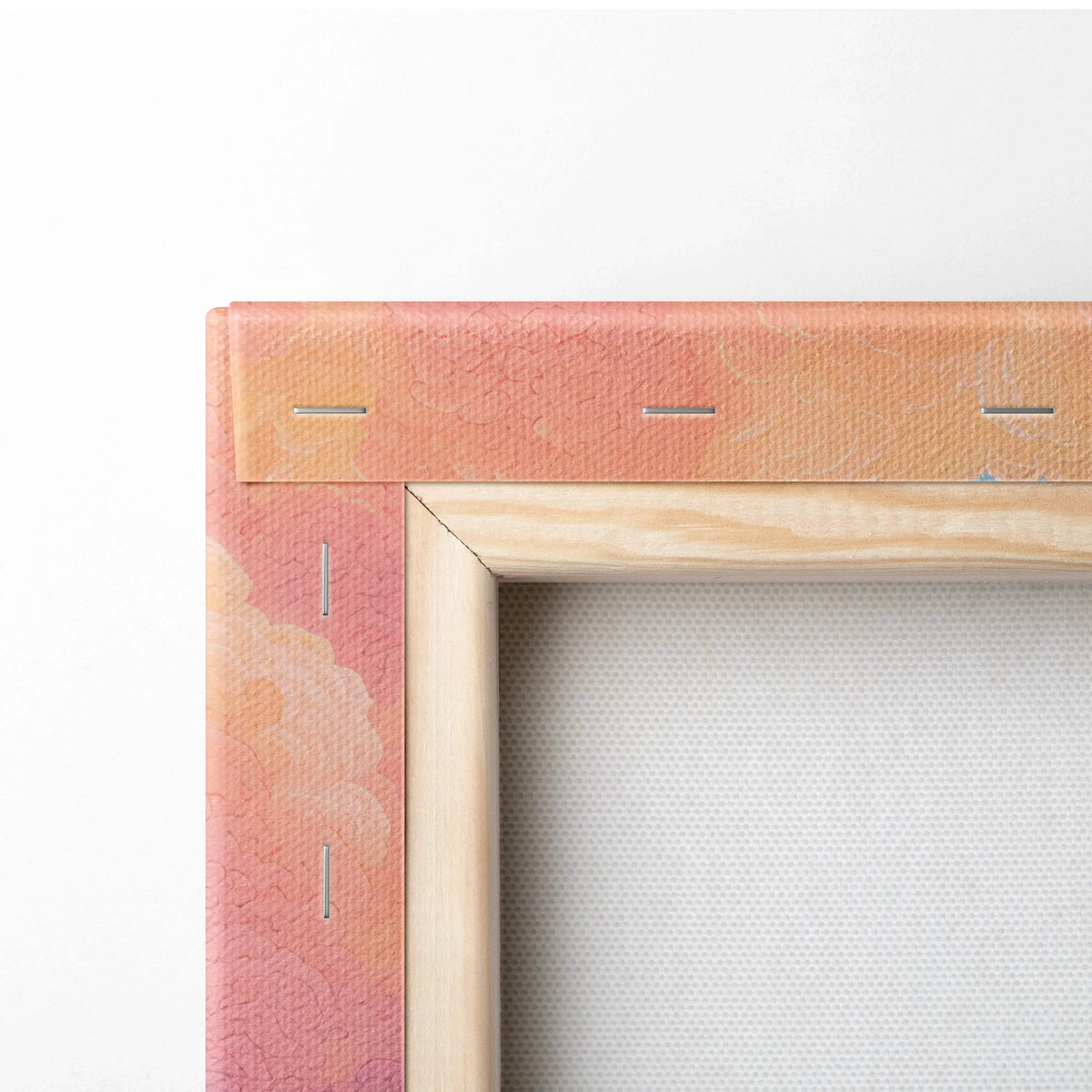 Back of Whimsical Cottage Landscape canvas with peach coral gradient and stitching
