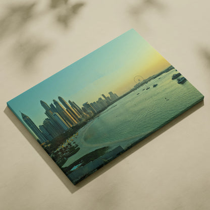 Vibrant cityscape canvas wall art featuring a glowing skyline at sunset with calm water reflections.