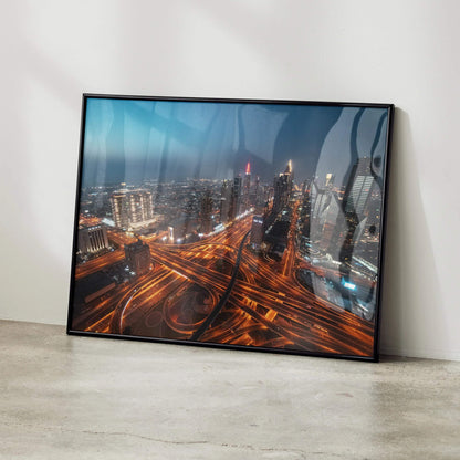 Vibrant city night skyline wall art poster with illuminated roads and high-rise buildings in black frame.