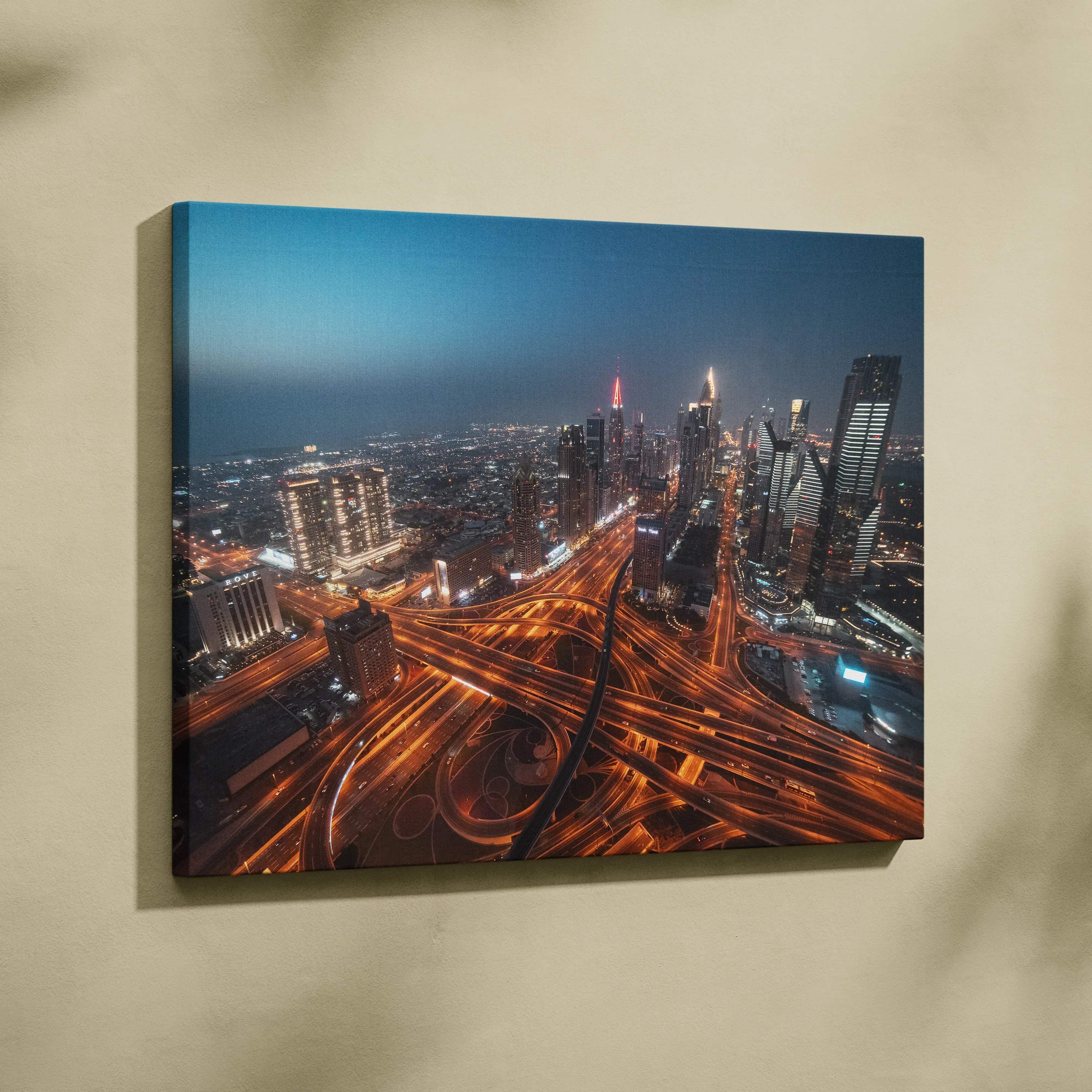 Urban nightscape canvas wall art featuring a vibrant aerial city skyline with illuminated highways and warm neon lights