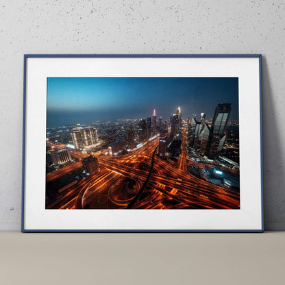 Vibrant city night skyline poster with illuminated skyscrapers and glowing highway intersections wall art.