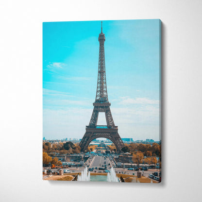 Eiffel Tower canvas wall art print with clear blue sky and Paris cityscape background.