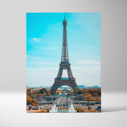 Eiffel Tower canvas wall art print with bright blue sky background in vertical format.