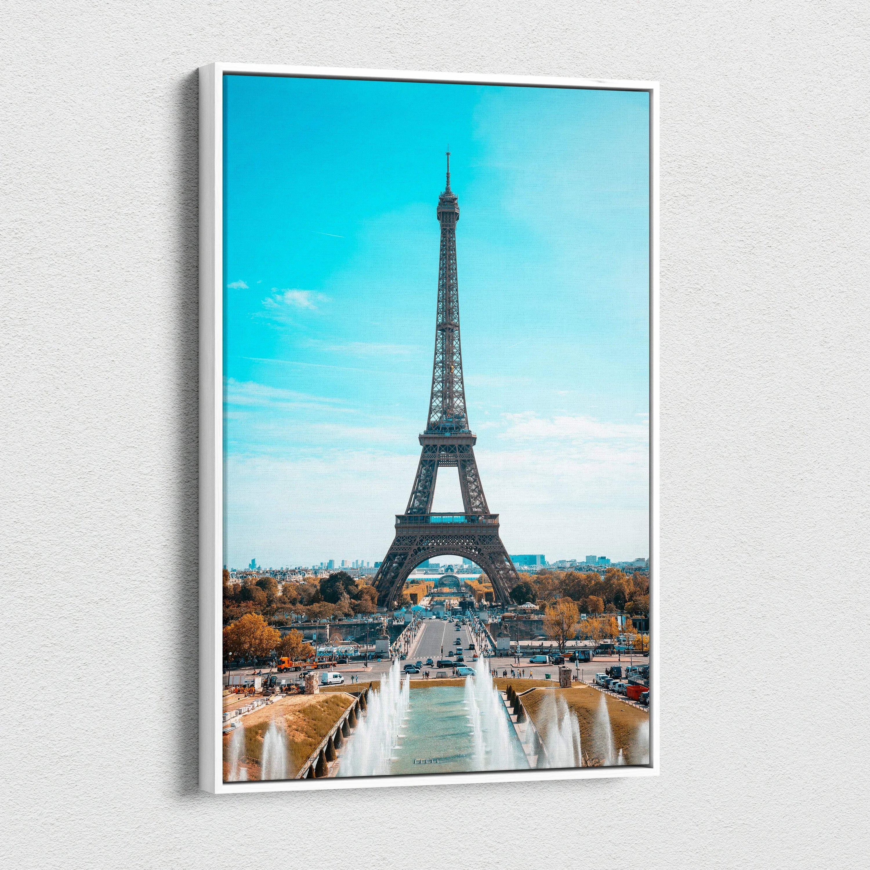 Vertical canvas wall art featuring the Eiffel Tower with bright blue sky background.