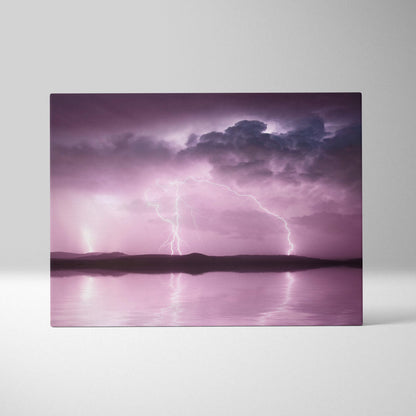 Pink lightning storm canvas art showing a purple stormy sky with lightning over a calm lake on rectangular canvas