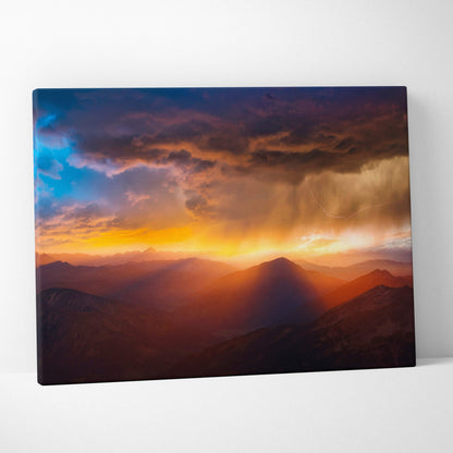 Canvas print of dramatic mountain sunset with vibrant orange yellow and deep purple clouds wall decor art