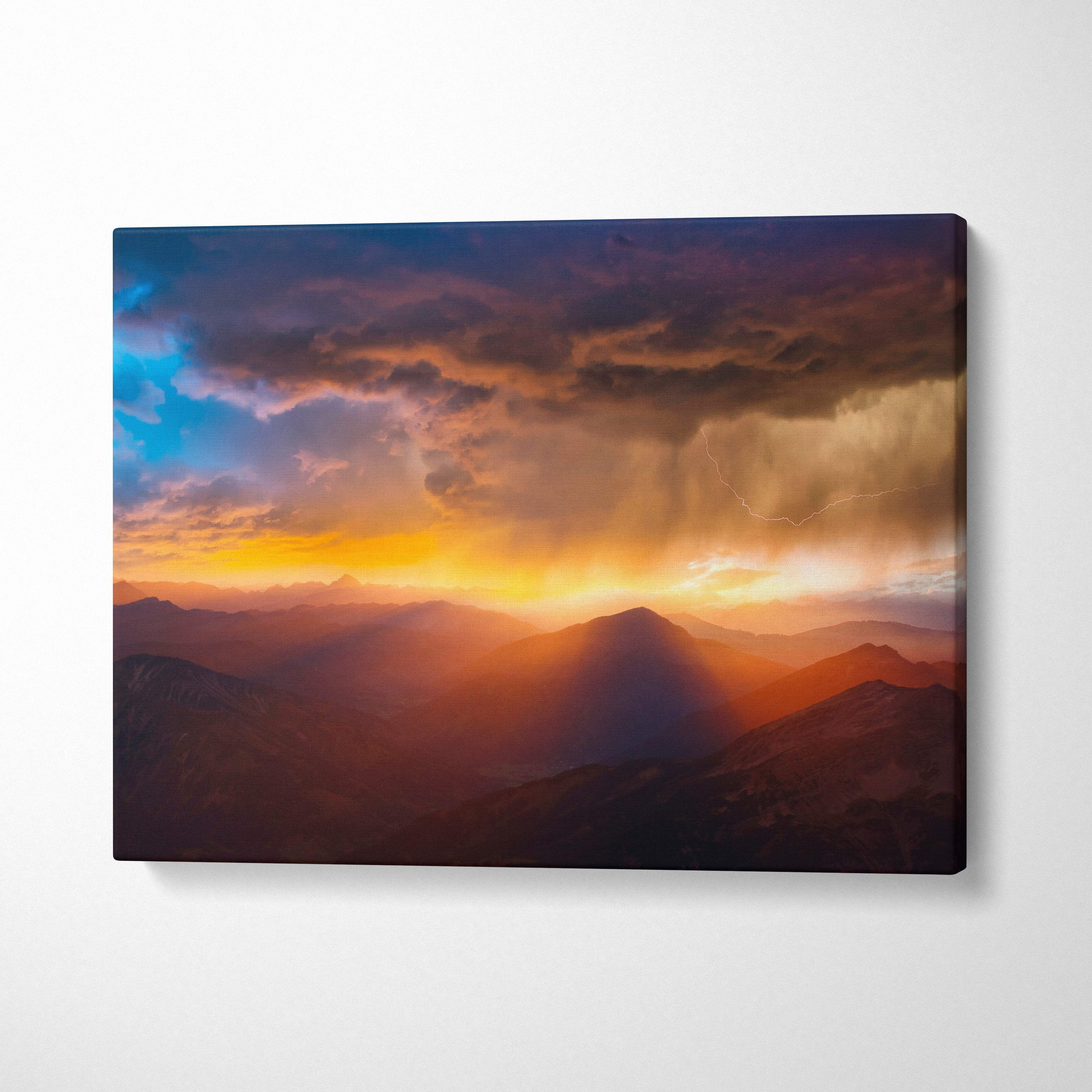 Vibrant mountain storm sunset canvas art with fiery orange yellow hues dramatic lightning and deep blue sky wall decor