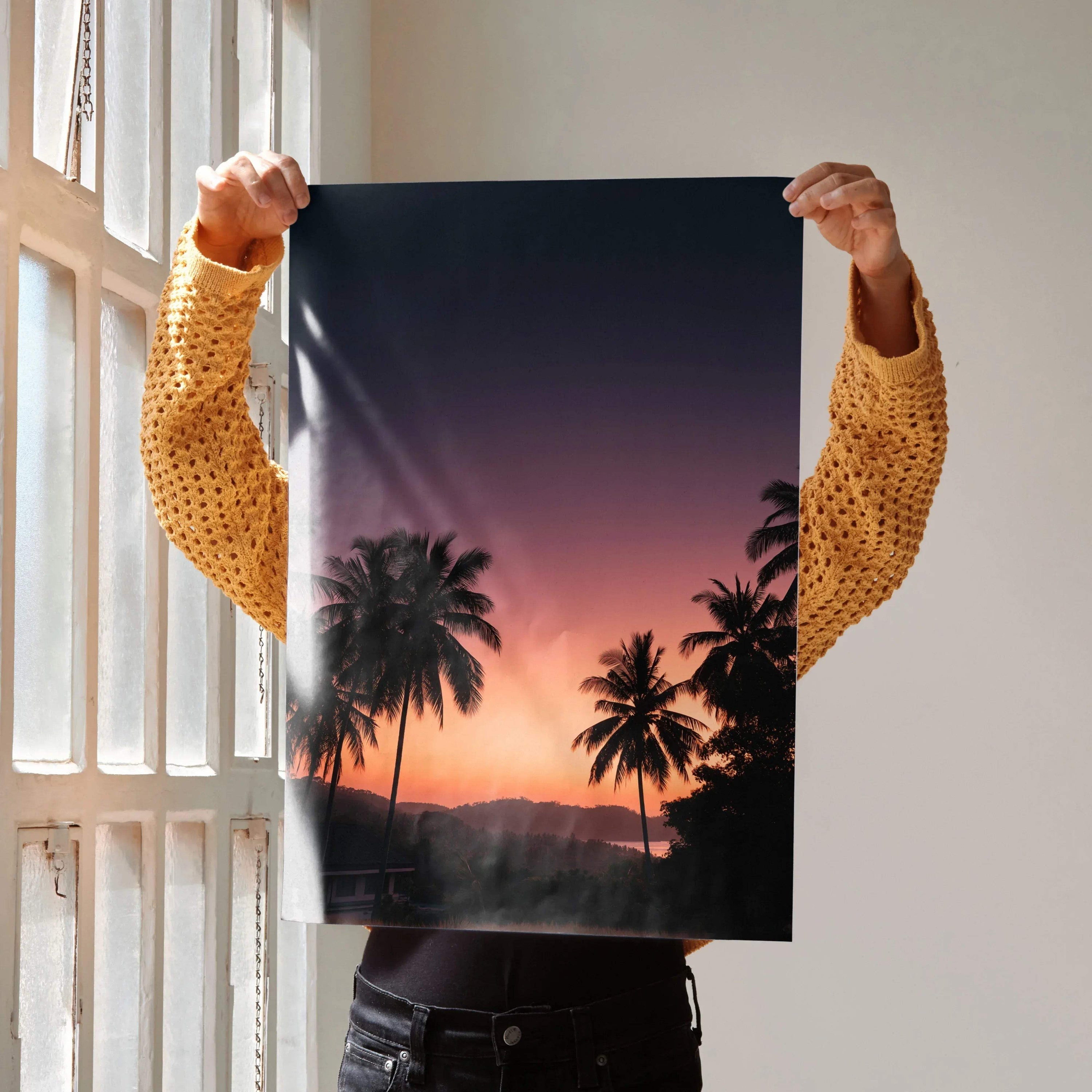 Vertical wall art poster featuring a golden hour sunset with palm trees silhouette and deep purple sky.
