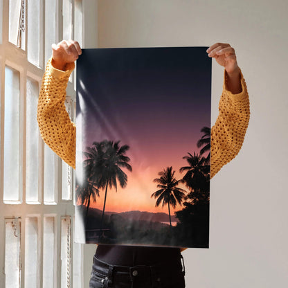 Vertical wall art poster featuring a golden hour sunset with palm trees silhouette and deep purple sky.
