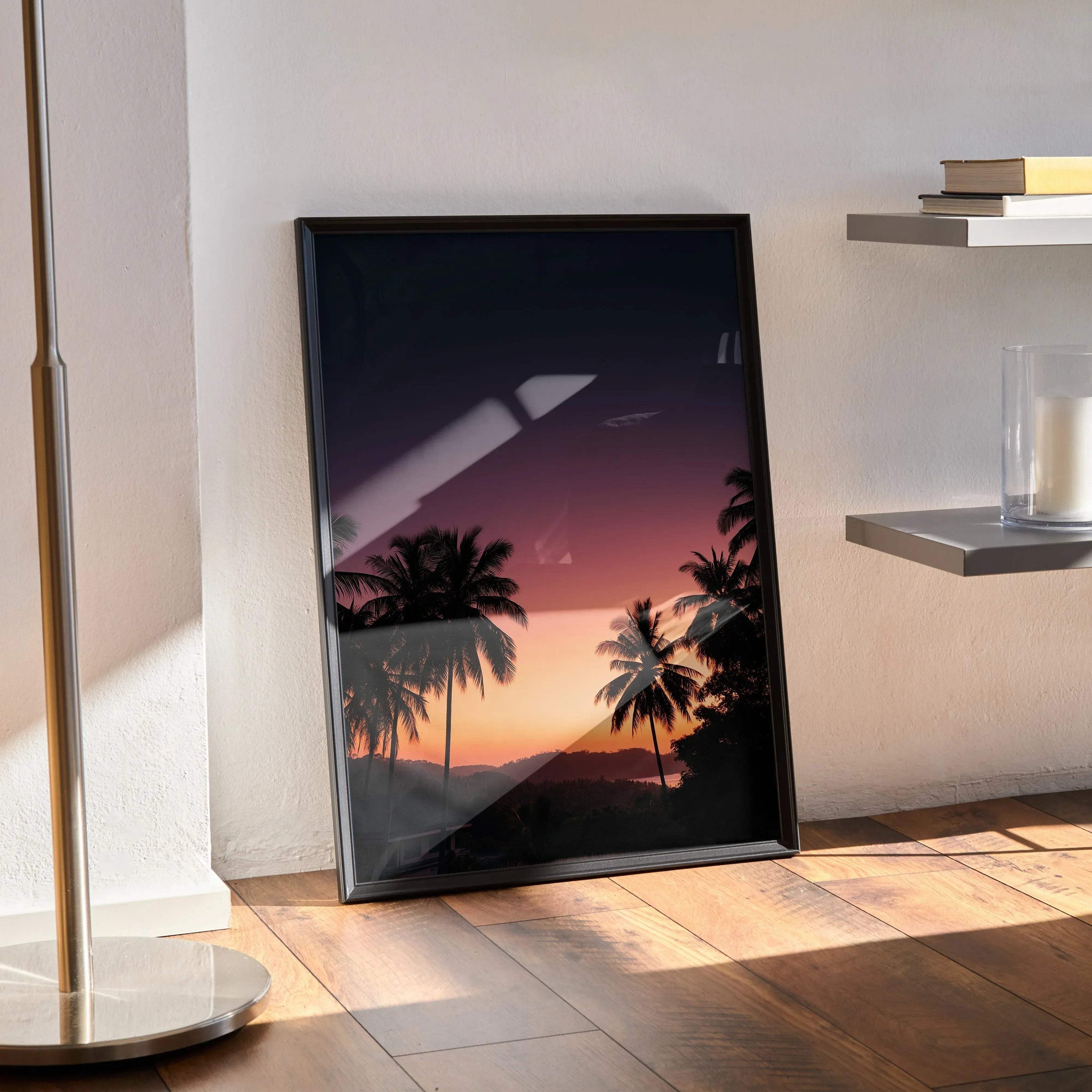 Golden hour sunset nature poster with silhouetted palm trees and vibrant sky in black frame wall art.