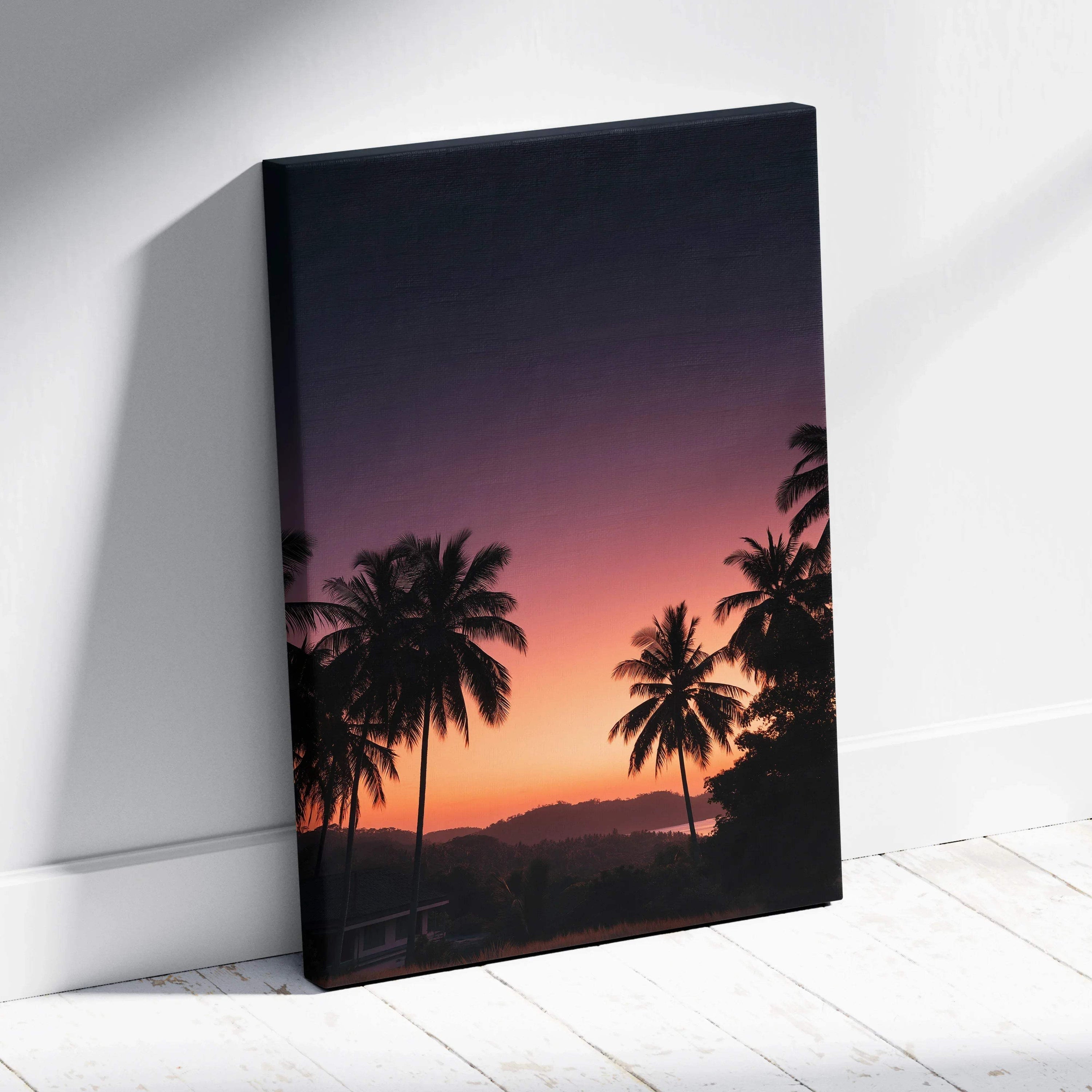 Canvas wall art featuring a vibrant sunset with silhouetted palm trees and mountains.