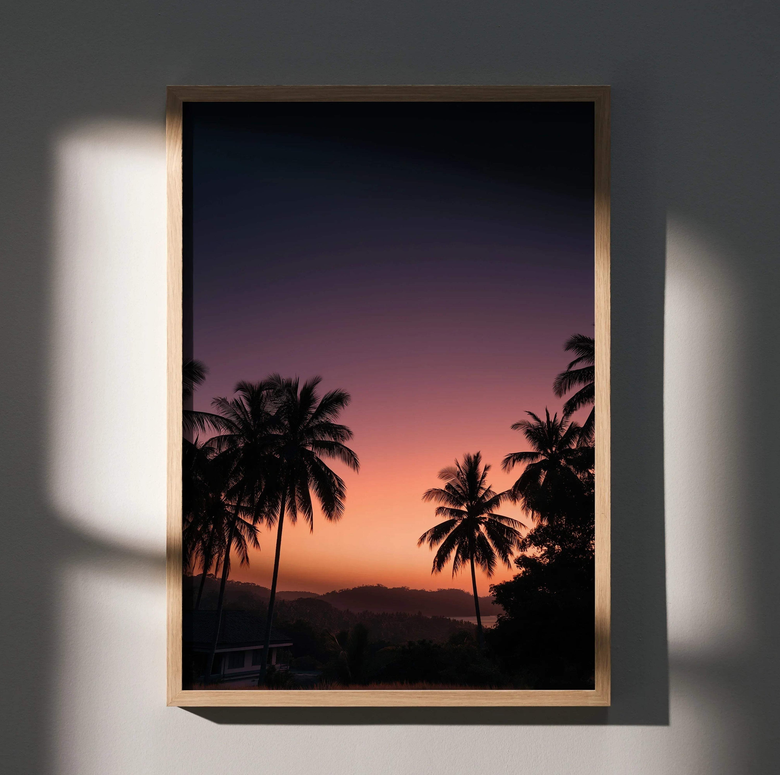 Vertical poster of golden hour sunset with silhouetted palm trees and distant hills, wall art.