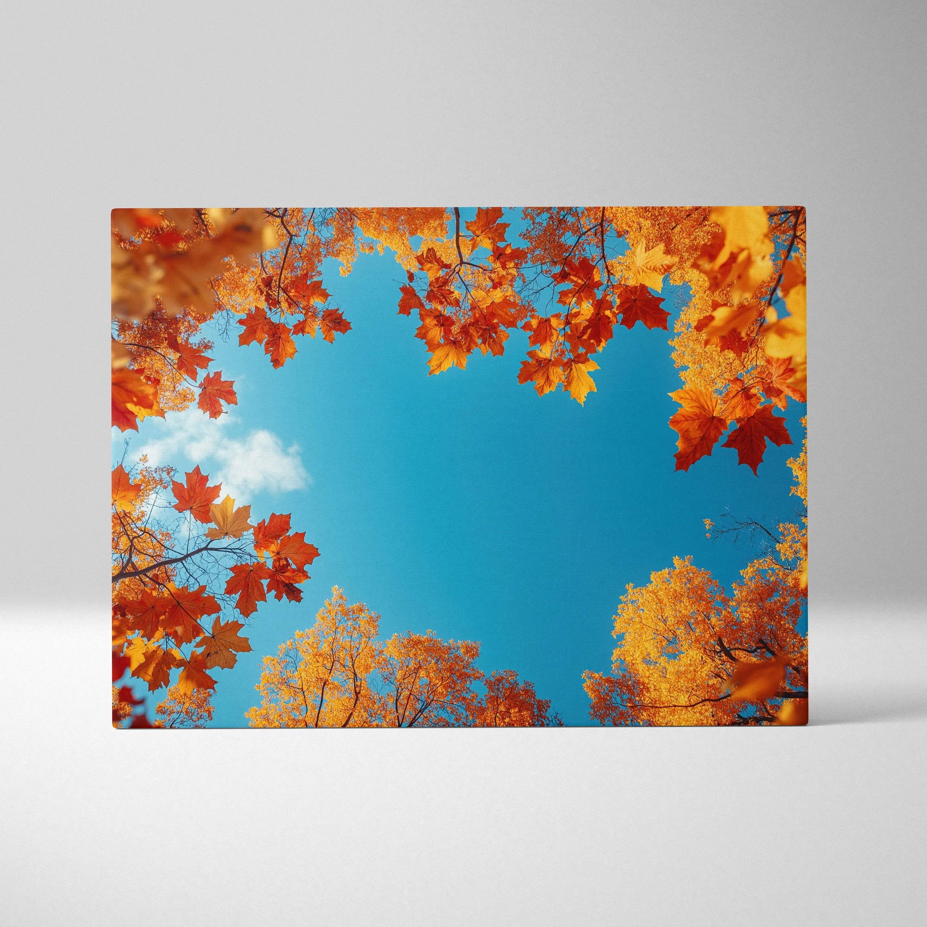 Vivid autumn leaves framing bright blue sky nature canvas wall art print.