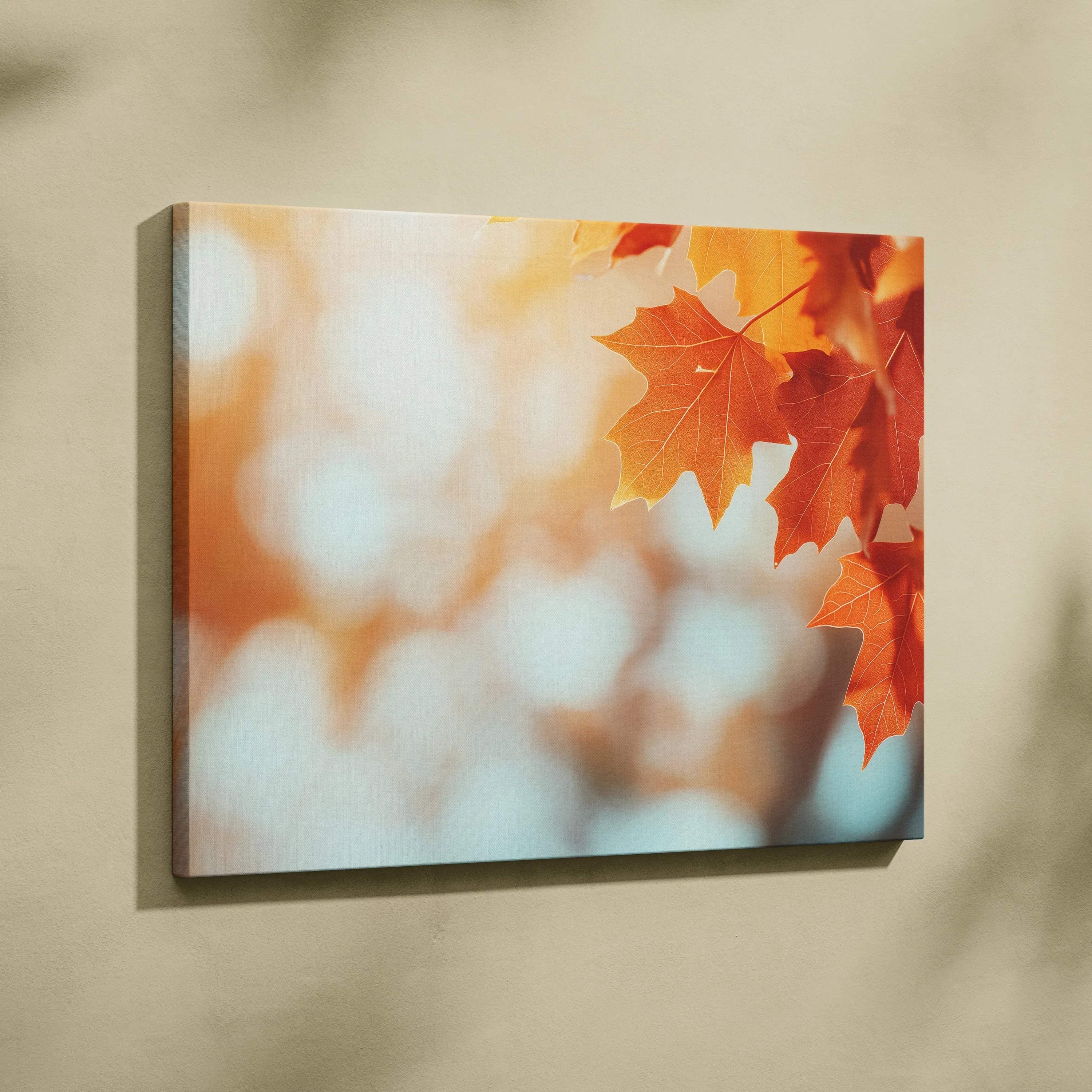 Autumn leaves with warm orange tones on a blurred background, canvas wall art with soft light highlights.