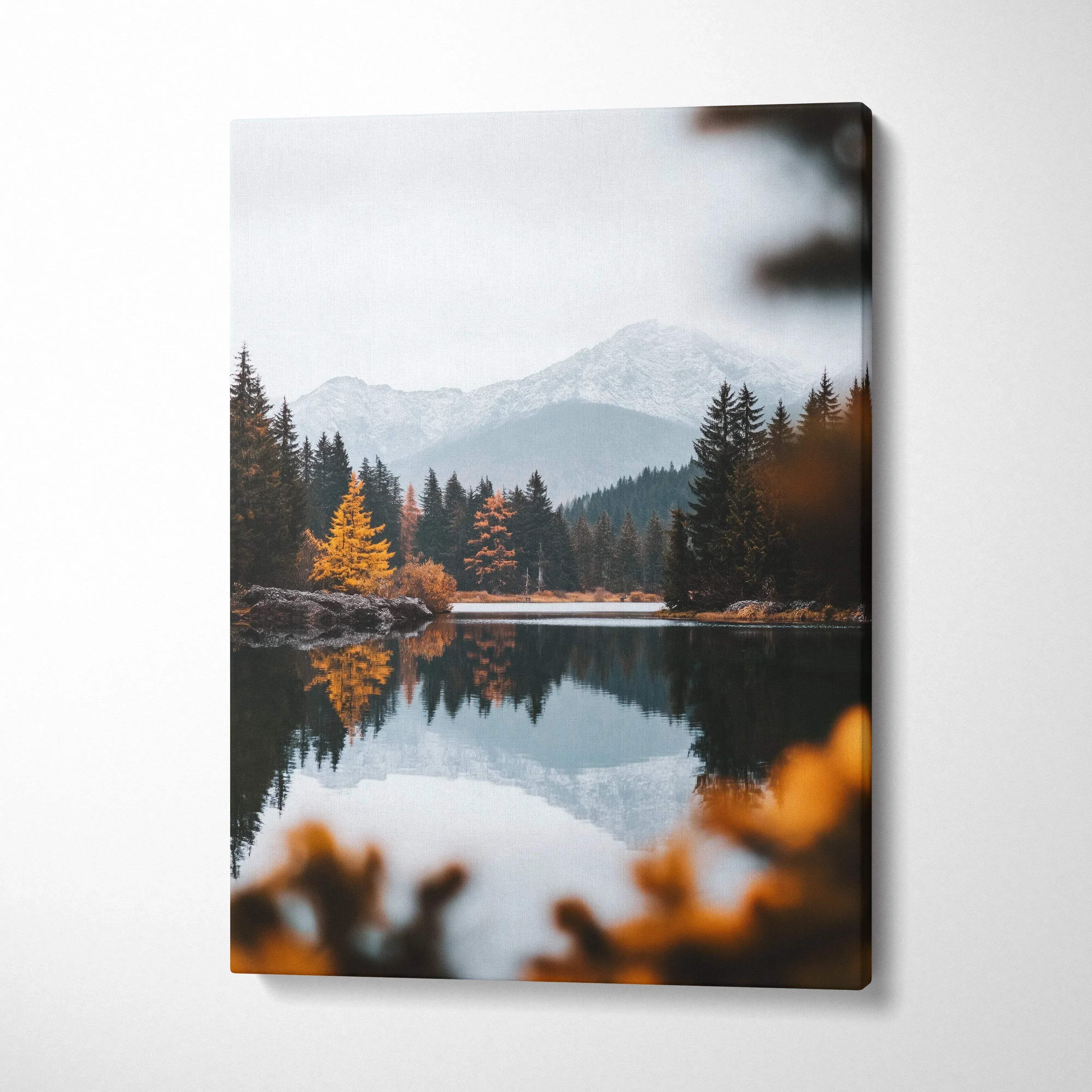 Vertical canvas wall art featuring autumn trees reflected on a calm lake with misty mountains backdrop.