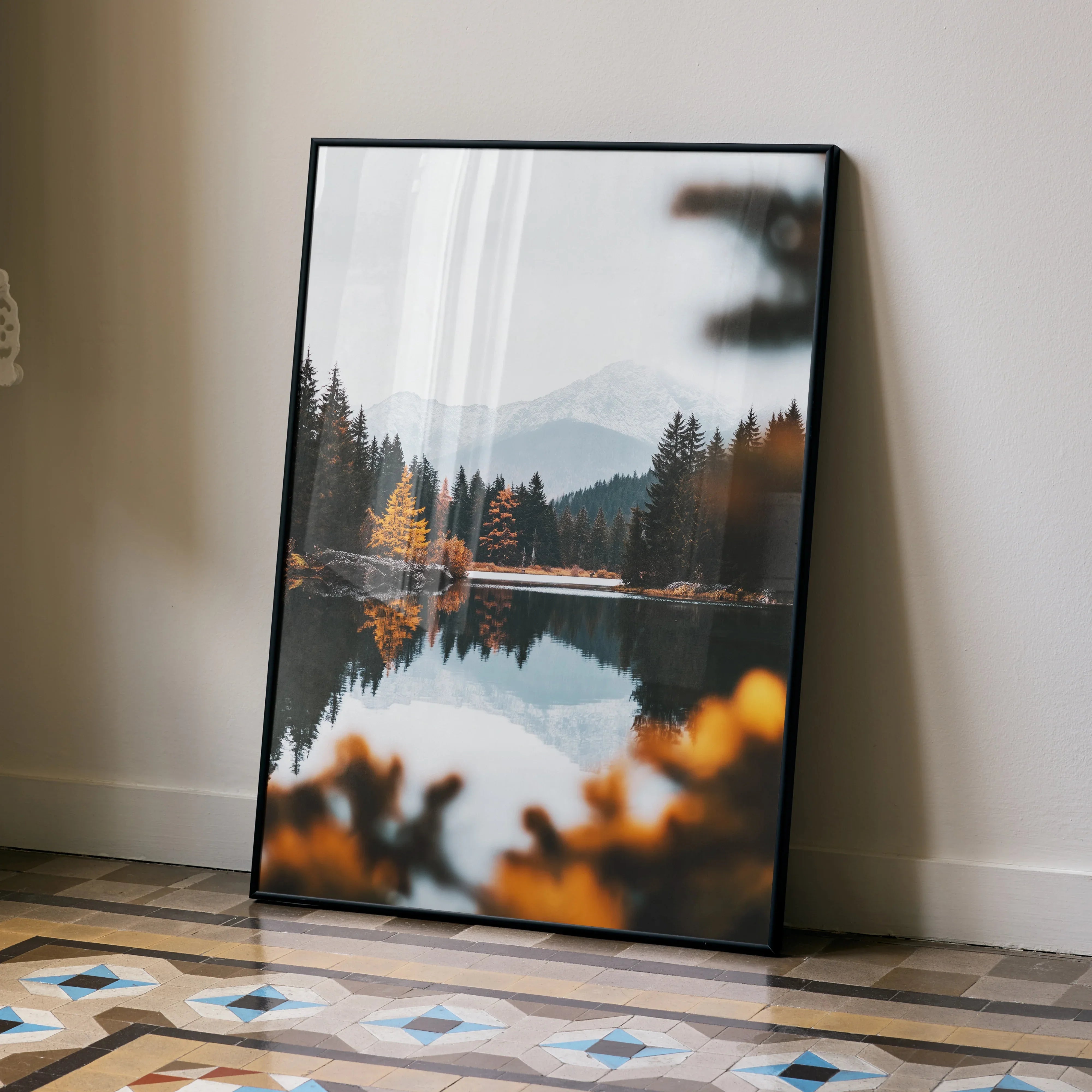 Vertical autumn forest poster with vibrant orange and green trees reflected on calm water, wall art print.