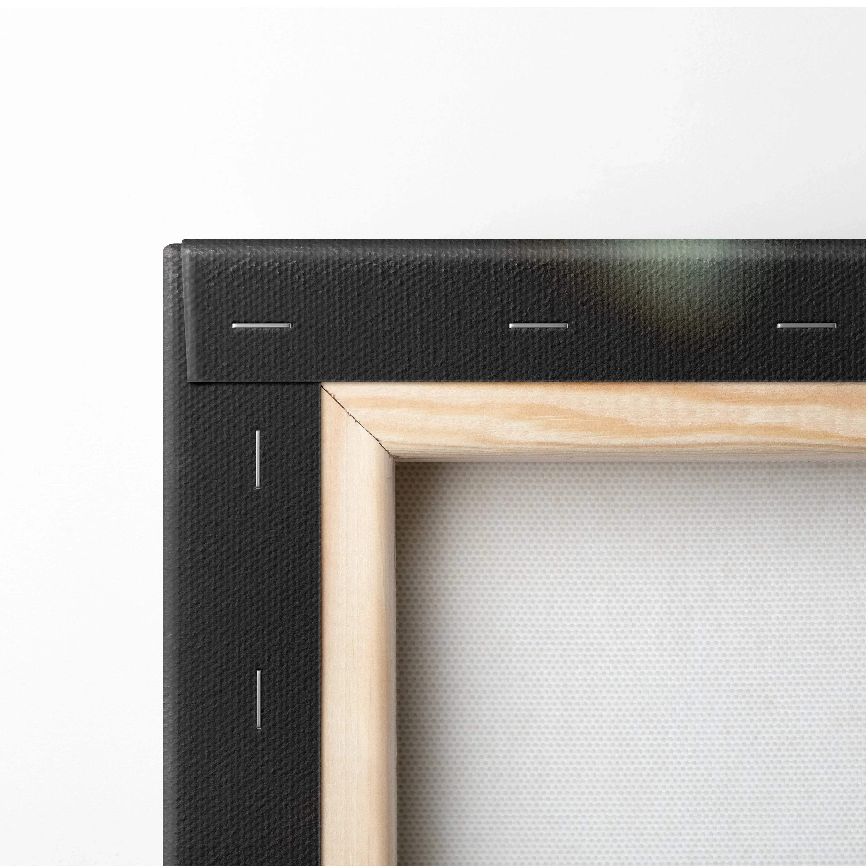 Black stretched canvas frame with natural wood stretcher bars for wall art print.