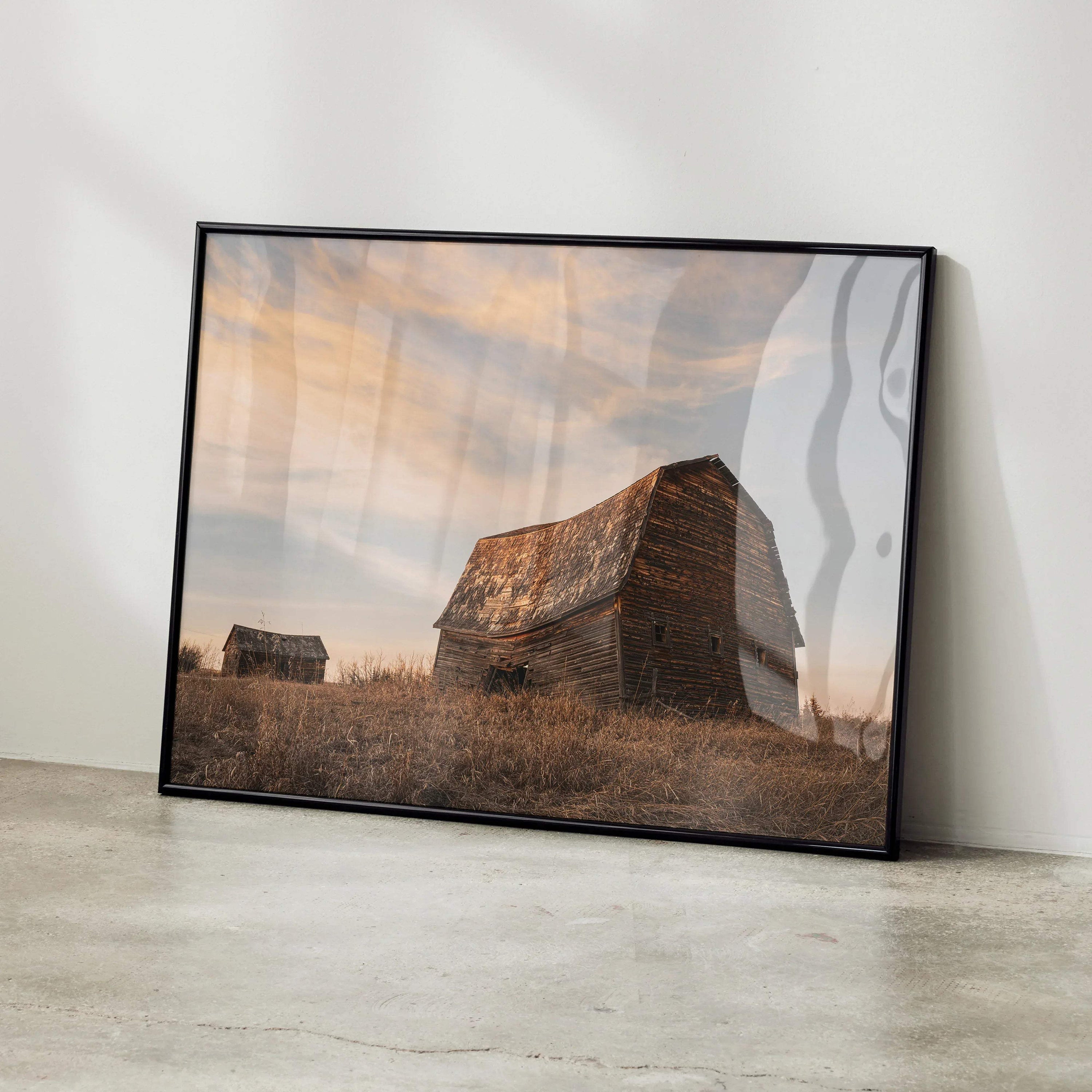 Sunset cityscape poster featuring rustic barns under a vibrant orange sky, wall art print.