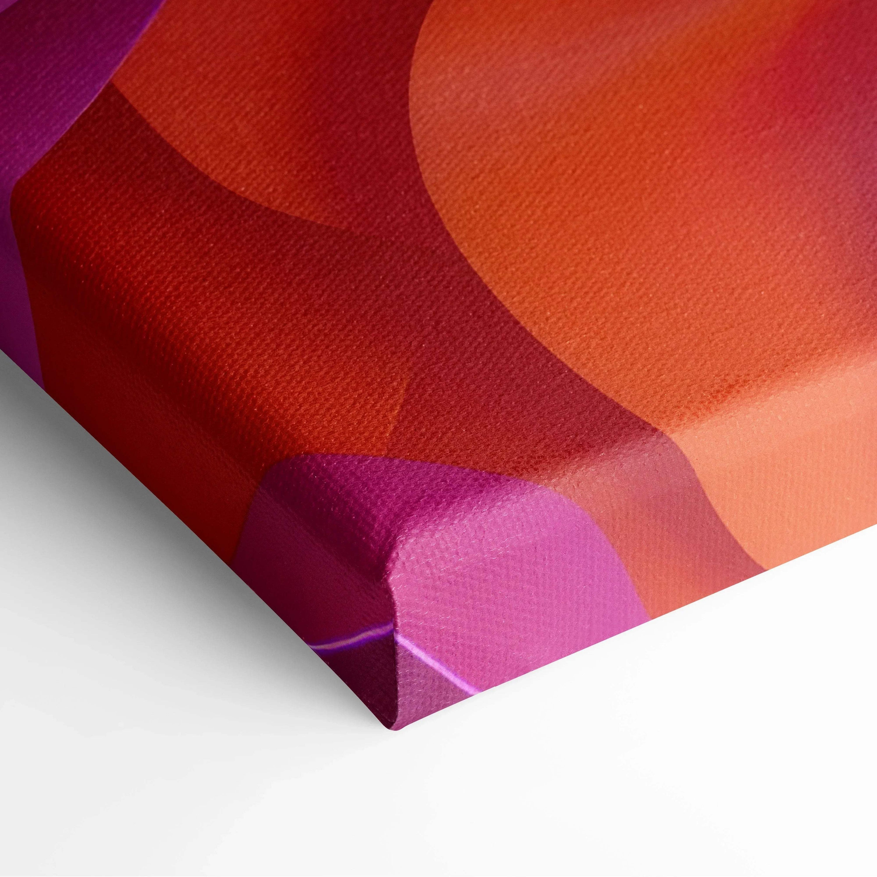 Close-up of vibrant abstract canvas art with bold red, orange, and purple fluid shapes on textured fabric surface.