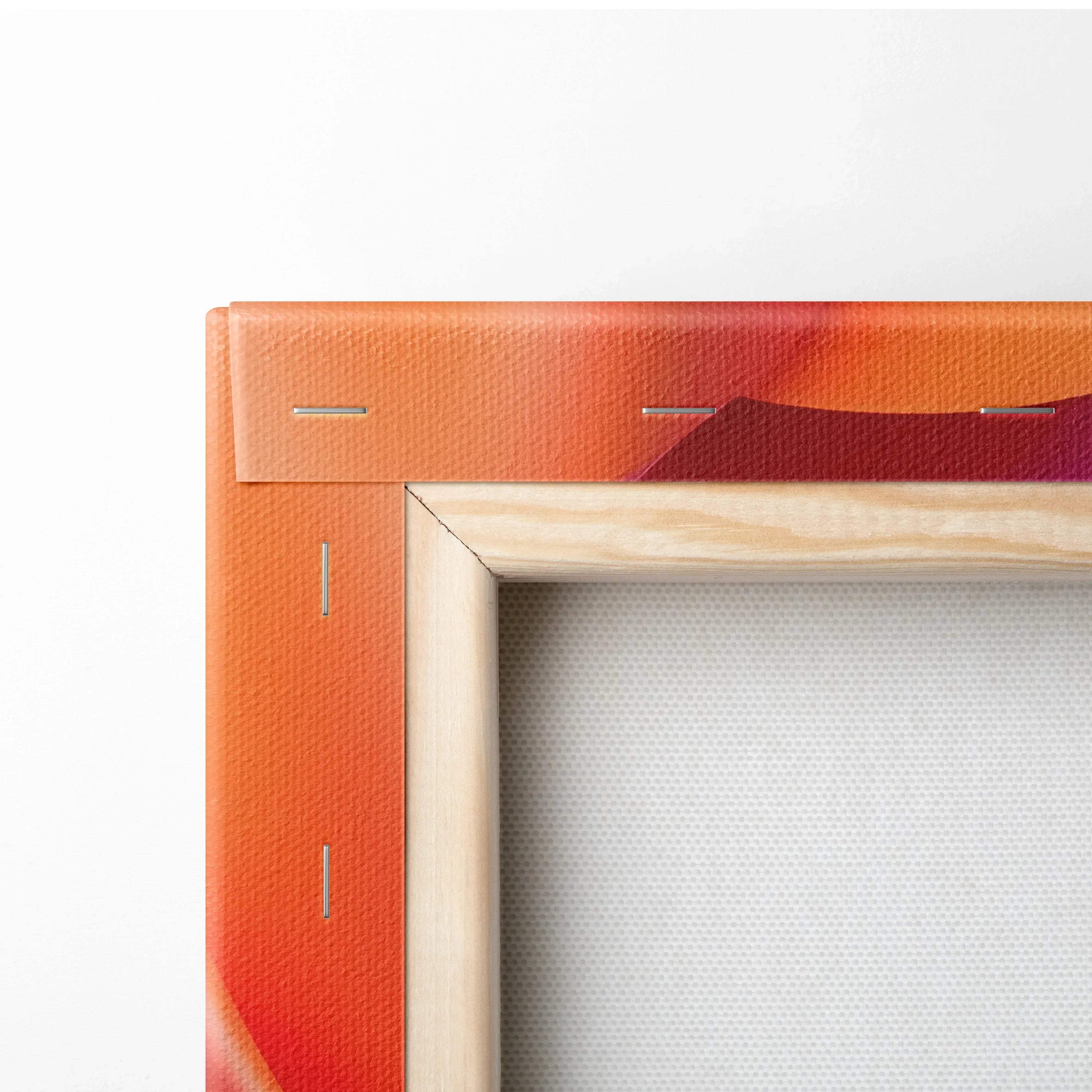 Close-up of canvas wall art corner showing vibrant orange and red abstract design with wooden frame and visible staples.